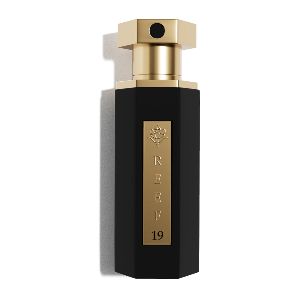 REEF – 19 mini unisex parfumflacon op witte achtergrond met roze lelie, jasmijn en witte muskus – een stralende en elegante geur in compact formaat